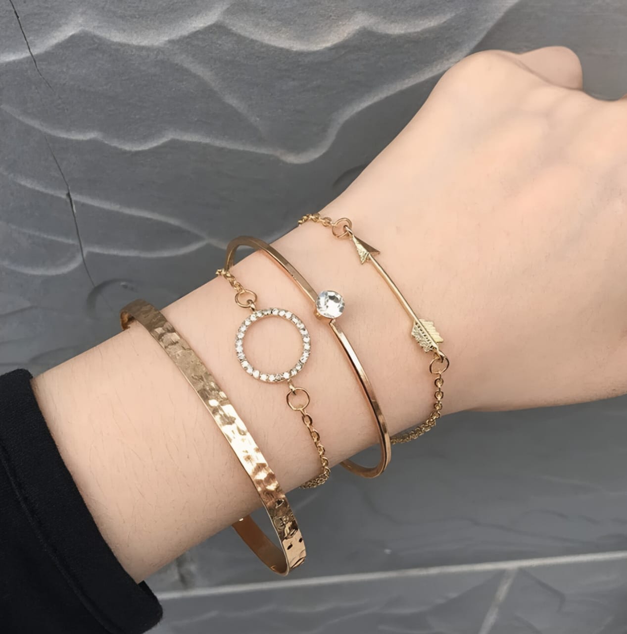 Set of 4 gold toned bracelets