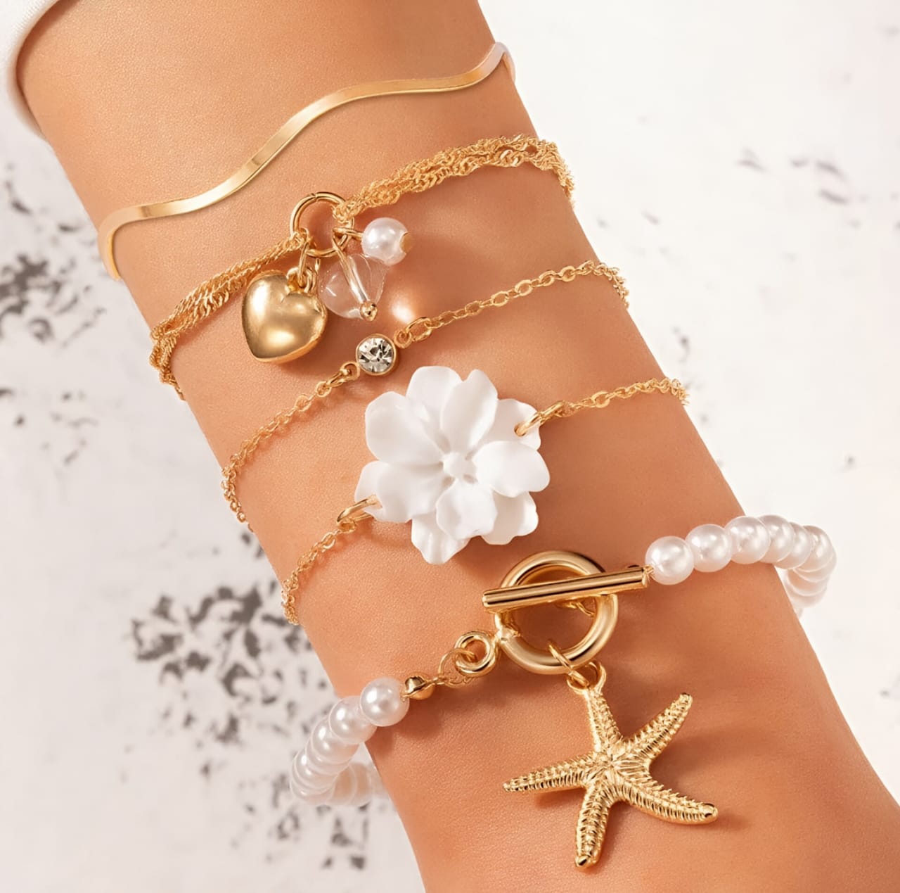 Set of 5 gold toned Korean bracelets