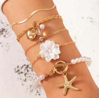 Set of 5 gold toned Korean bracelets