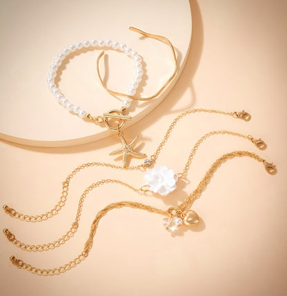 Set of 5 gold toned Korean bracelets